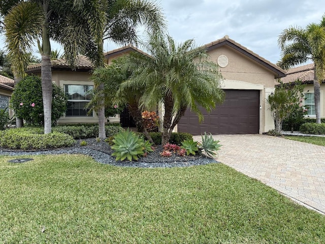 view of front of house featuring a garage and a front yard