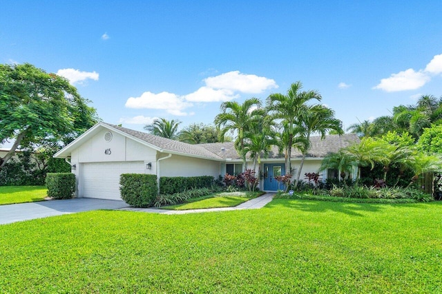 single story home with a garage and a front lawn