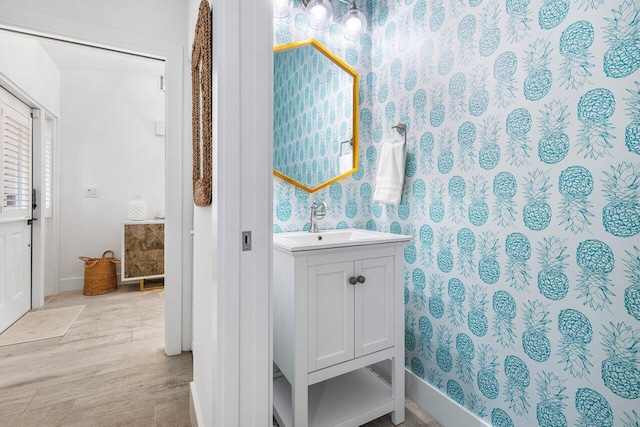 bathroom featuring hardwood / wood-style flooring and vanity