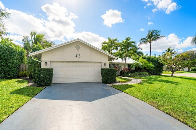 ranch-style house with a garage and a front yard