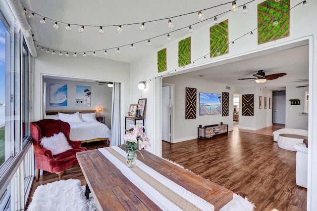 bedroom with dark hardwood / wood-style floors