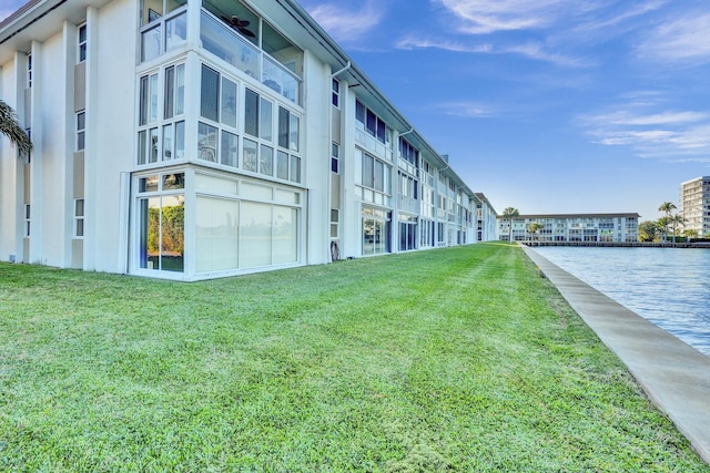 view of building exterior with a water view