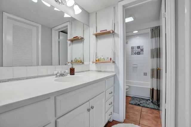 full bathroom with tile patterned floors, vanity, toilet, and shower / bath combination with curtain