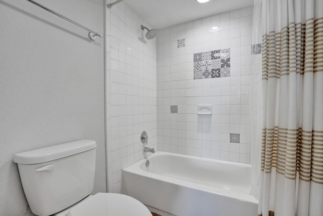 bathroom with toilet and shower / bath combination with curtain