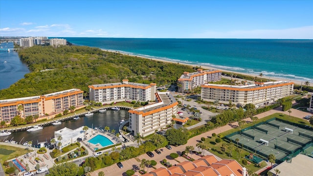 bird's eye view featuring a beach view and a water view