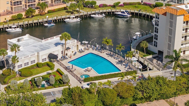 birds eye view of property with a water view