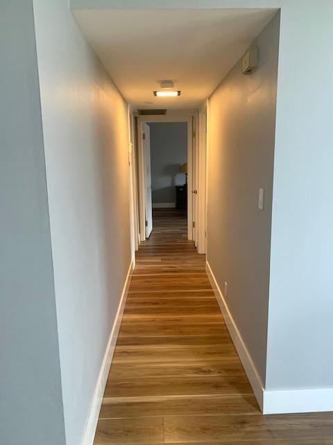 hallway featuring hardwood / wood-style flooring