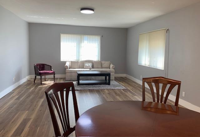 interior space with plenty of natural light and hardwood / wood-style flooring