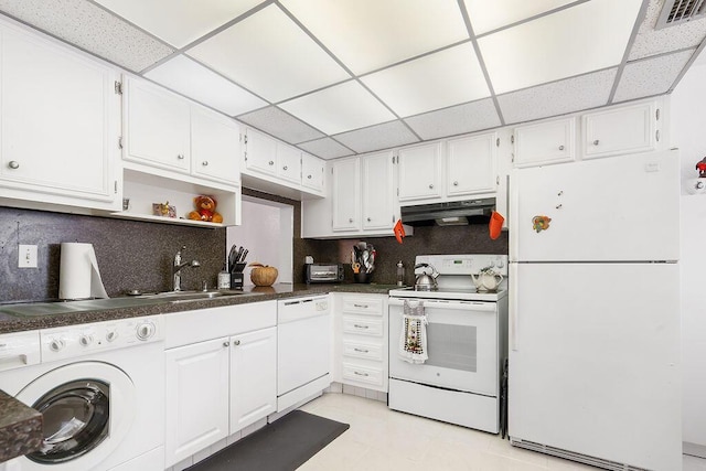 kitchen featuring a paneled ceiling, washer / clothes dryer, white appliances, and white cabinets