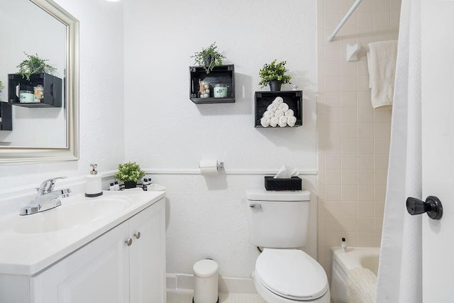 full bathroom with toilet, vanity, and tiled shower / bath