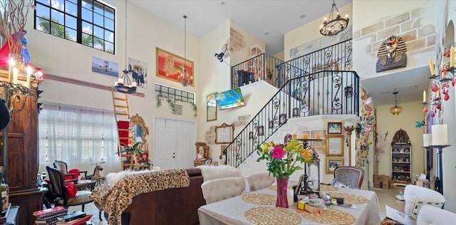 living room with light tile patterned floors and a towering ceiling