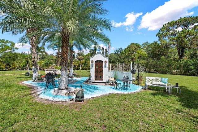 view of pool featuring a yard