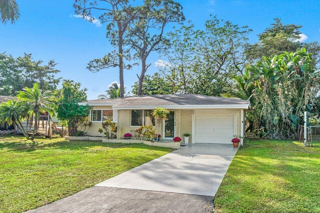 ranch-style home with a front yard and a garage