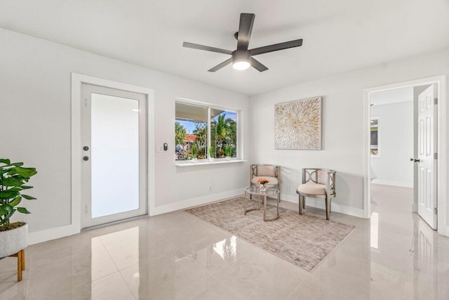 sitting room featuring ceiling fan