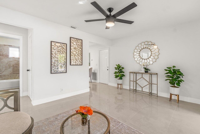 interior space featuring ceiling fan