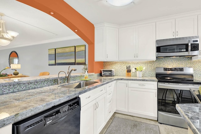 kitchen featuring light tile patterned floors, stainless steel appliances, backsplash, white cabinets, and sink