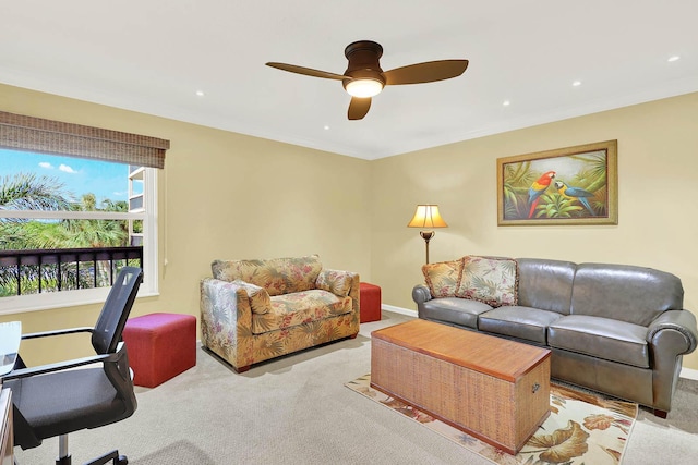 carpeted living room with ceiling fan