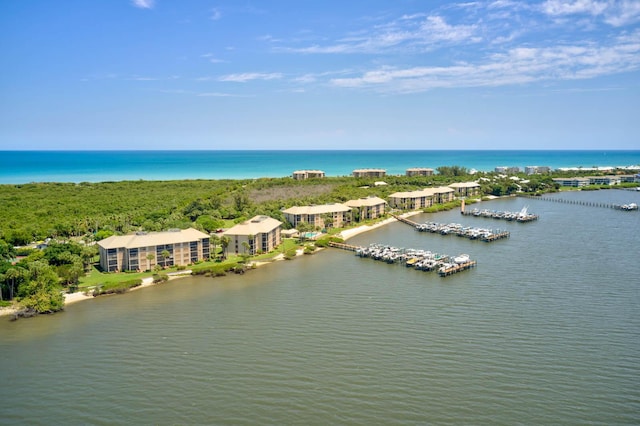 birds eye view of property featuring a water view