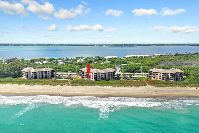 aerial view with a water view and a view of the beach