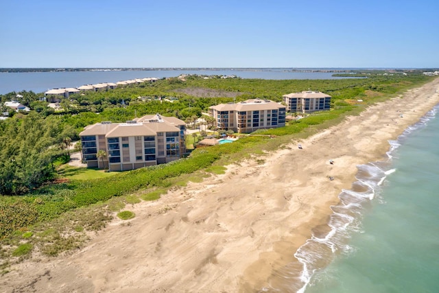 aerial view with a water view and a view of the beach