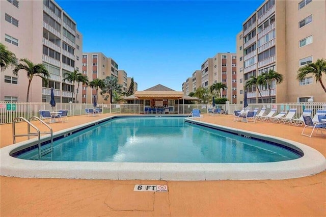 view of swimming pool with a patio