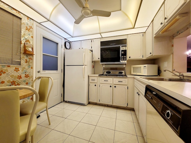 kitchen with ceiling fan, white appliances, sink, and light tile patterned floors