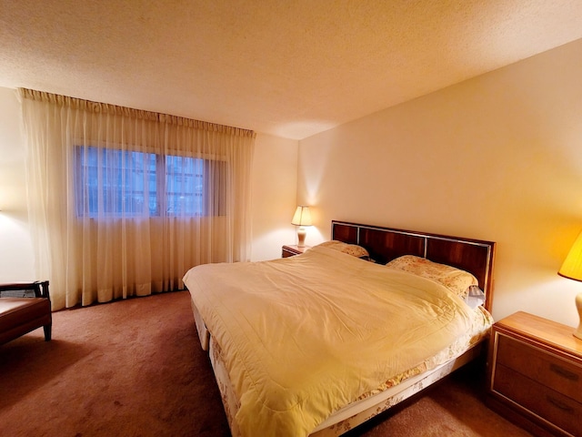 carpeted bedroom featuring a textured ceiling