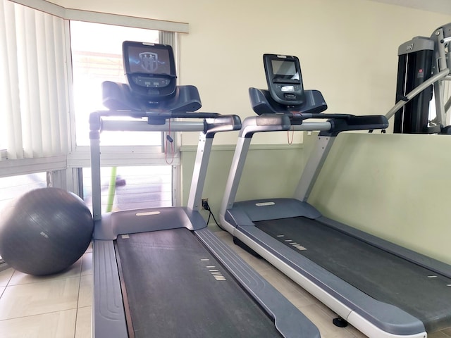 workout room with tile patterned floors