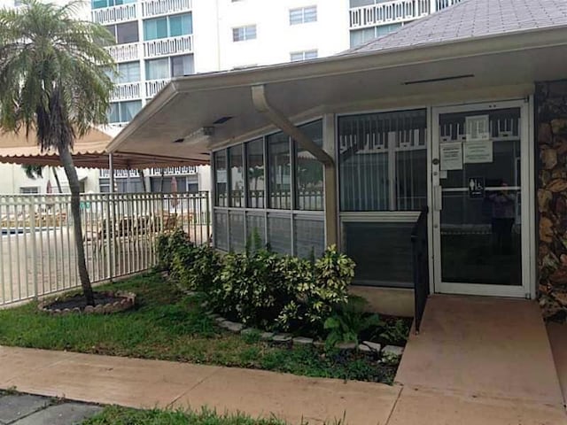 view of side of home with a sunroom