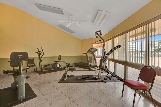 exercise room featuring ceiling fan and vaulted ceiling