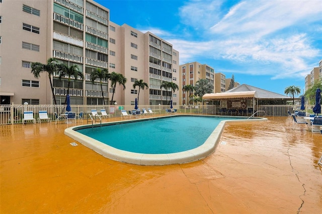 view of swimming pool with a patio