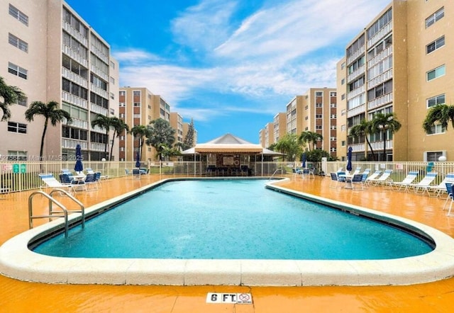 view of swimming pool with a patio area