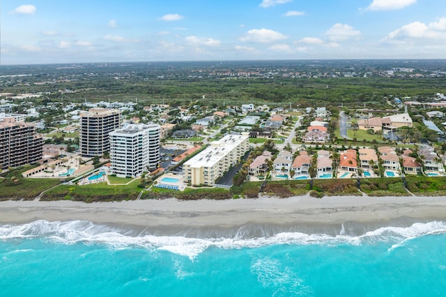 bird's eye view featuring a water view and a view of the beach