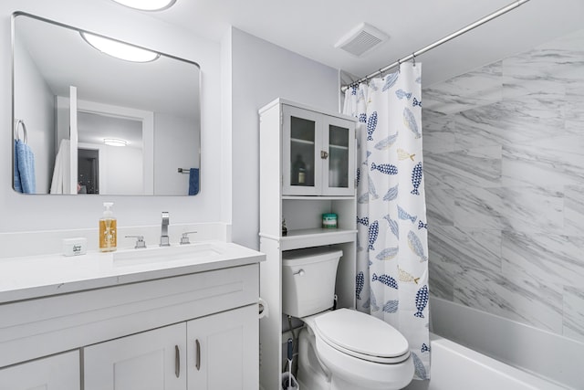 full bathroom with shower / bath combo with shower curtain, toilet, and vanity