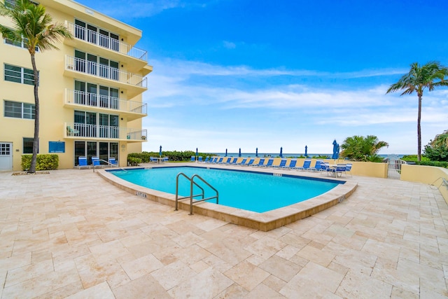 view of swimming pool featuring a patio area