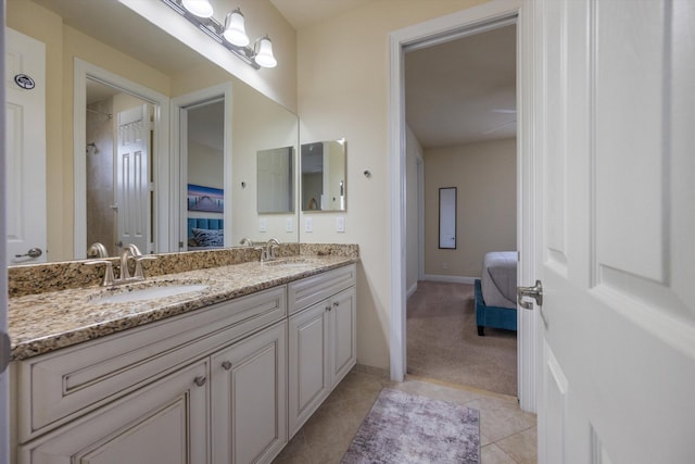 bathroom with tile patterned floors and vanity