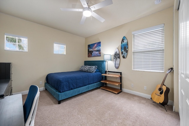 carpeted bedroom featuring ceiling fan