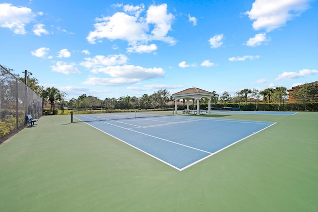 view of tennis court with a gazebo