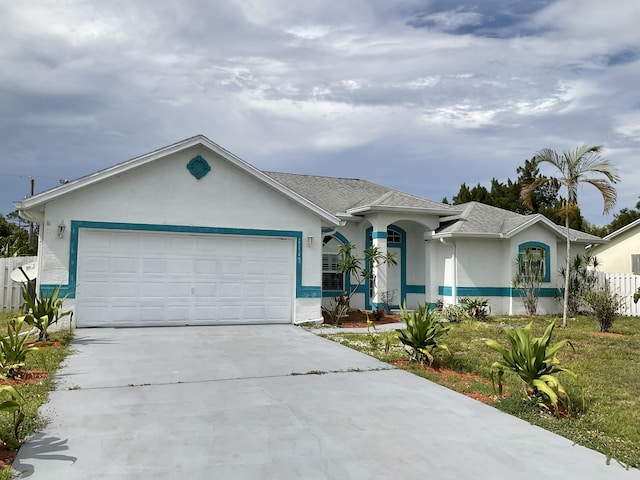 ranch-style home featuring a garage