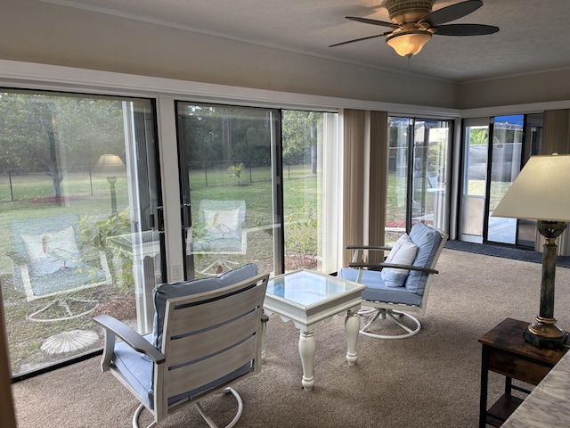 sunroom / solarium with ceiling fan