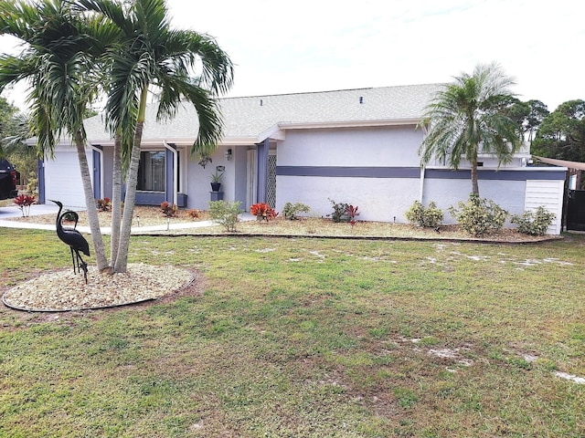 ranch-style house with a garage and a front yard