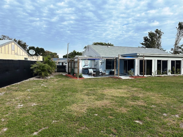 back of house featuring a yard and a patio area