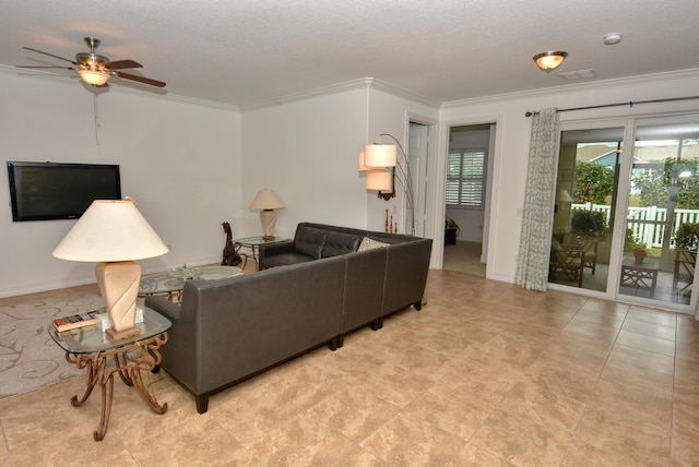 living room with a textured ceiling, ornamental molding, and ceiling fan