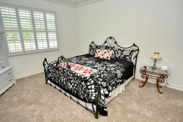 carpeted bedroom featuring ornamental molding