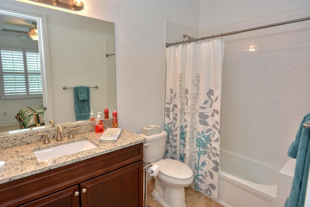 full bathroom featuring vanity, toilet, ceiling fan, and shower / bath combo with shower curtain