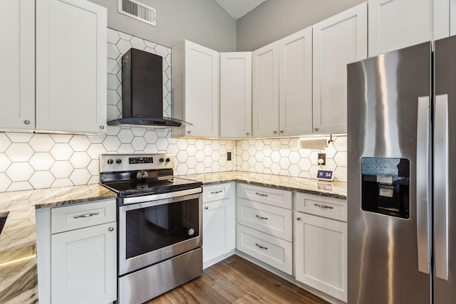 kitchen with white cabinetry, stainless steel appliances, wall chimney exhaust hood, and backsplash