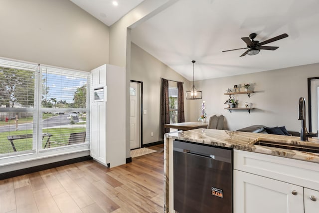 kitchen featuring light wood-type flooring, sink, stone counters, and white cabinetry