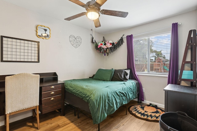 bedroom featuring ceiling fan and light hardwood / wood-style flooring