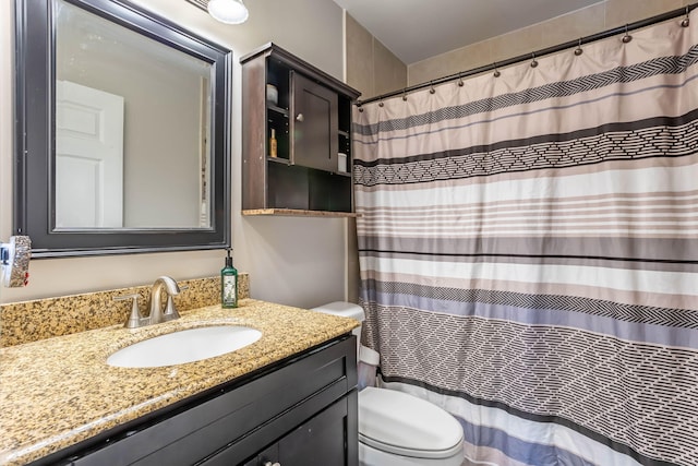 bathroom with toilet and vanity