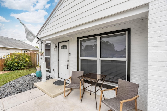 doorway to property with a patio area